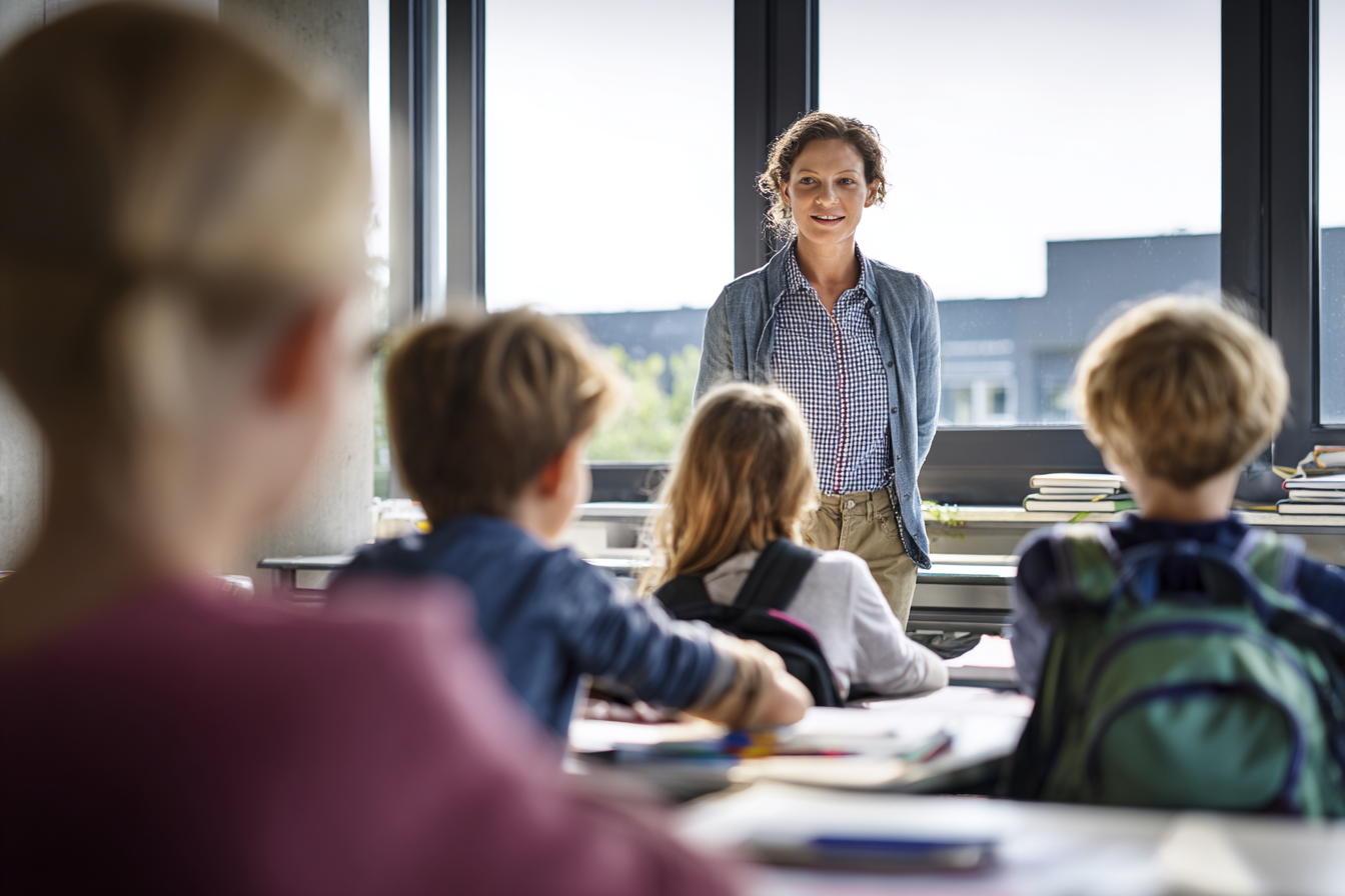 A teacher teaching a group of children